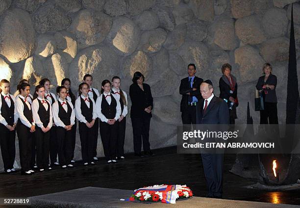 Russian President Vladimir Putin stands next to a wreath at the remembrance hall of the holocaust memorial of Yad Vashem in Jerusalem, 28 April 2005....