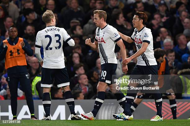 Harry Kane of Tottenham Hotspur is congratulated by teammates after scoring the opening goal during the Barclays Premier League match between Chelsea...