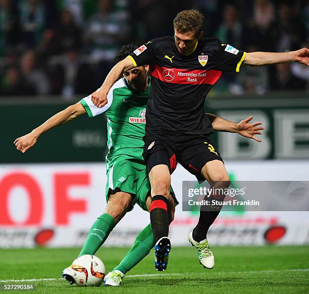 Claudio Pizarro of Werder Bremen scores their fourth goal as Daniel Schwaab of Stuttgart challenges during the Bundesliga match between Werder Bremen...