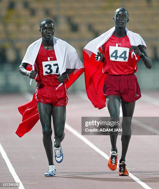 Tariq Mubarak and Mohammed Esmaeel celebrate after wining the gold and silver medal respectively for the 2000m steeplechase during the GCC Athletics...