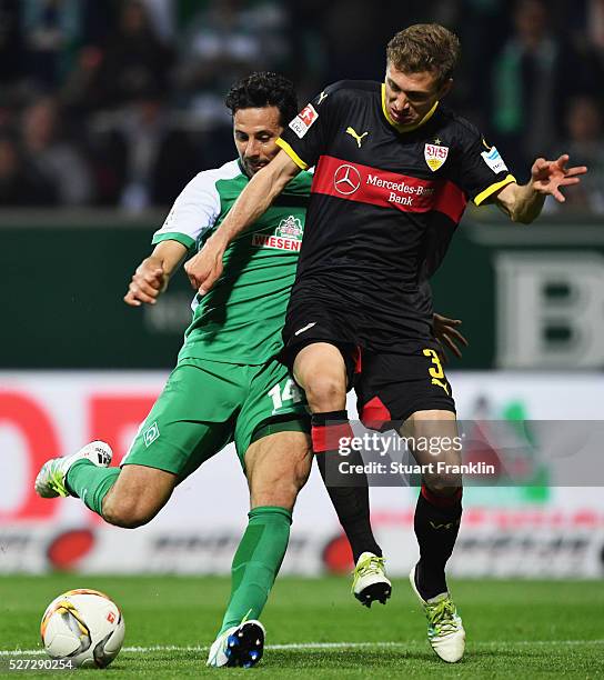 Claudio Pizarro of Werder Bremen scores their fourth goal as Daniel Schwaab of Stuttgart challenges during the Bundesliga match between Werder Bremen...