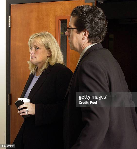 Debbie Rowe , Michael Jackson's ex-wife and mother of two of his children, walks out of the courtroom with unidentified man during Michael Jackson's...