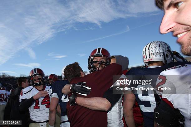 Harvard players and fans celebrate victory after the Yale V Harvard, Ivy League Football match at Yale Bowl. Harvard won the game 34-7 giving Harvard...