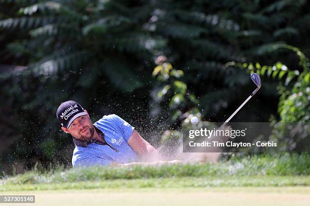 Ryan Moore, USA, plays out of a bunker during the final round of the Travelers Championship at the TPC River Highlands, Cromwell, Connecticut, USA....