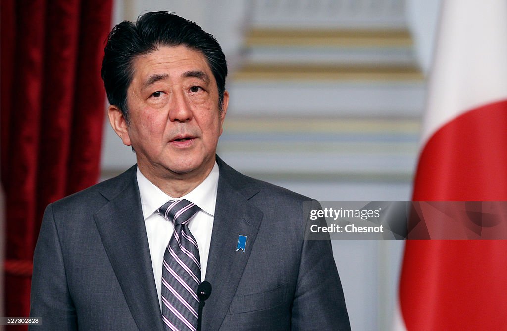 French President Francois Hollande receives Japanese Prime Minister Shinzo Abe At the Elysee Palace In Paris