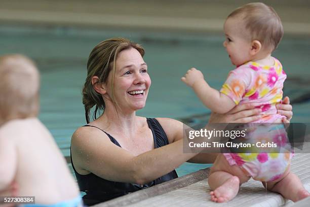 Nine month old baby girl and her mother at a learn to swim class. Photo Tim Clayton