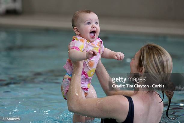 Nine month old baby girl and her mother at a learn to swim class. Photo Tim Clayton