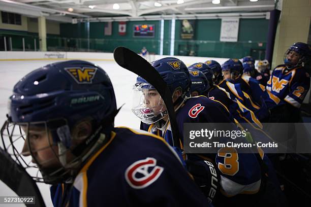 Players watch from the bench during the Mid Fairfield Yankees Pee Wee Major Ice Hockey team against the Philadelphia Junior Flyers at Chelsea Piers...