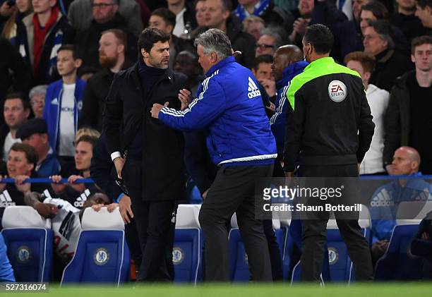 Mauricio Pochettino the manager of Tottenham Hotspur and Guus Hiddink the interim manager of Chelsea clash during the Barclays Premier League match...
