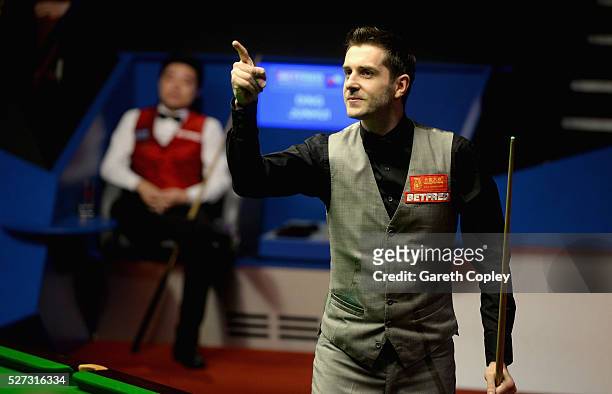 Mark Selby celebrates potting frame ball to beat Ding Junhui to win the World Snooker Championship final at the Crucible Theatre on May 02, 2016 in...