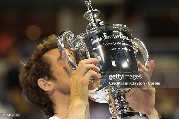 Andy Murray, Great Britain, with his hands on his first grand slam trophy after his five set victory against Novak Djokovic, Serbia, in the Men's...