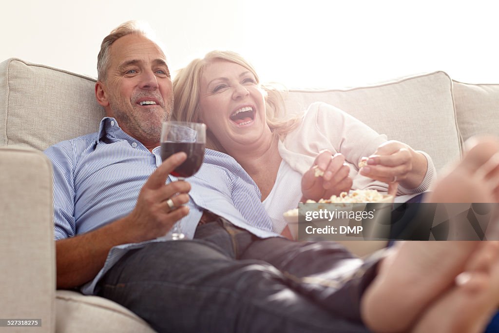 Mature couple enjoying watching movie