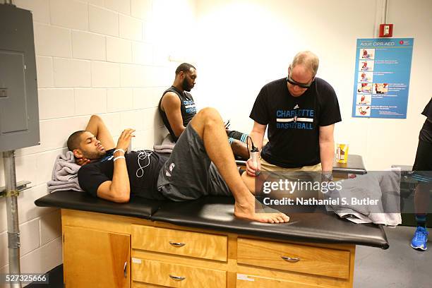 Nicolas Batum of the Charlotte Hornets gets treatment prior to the game against the Miami Heat in Game Seven of the Eastern Conference Quarterfinals...