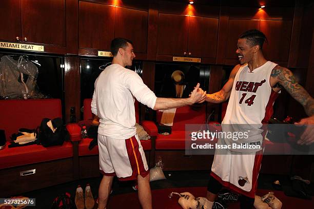 Goran Dragic and Gerlad Green of the Miami Heat celebrates in the locker room after Game Seven of the Eastern Conference Quarterfinals against the...