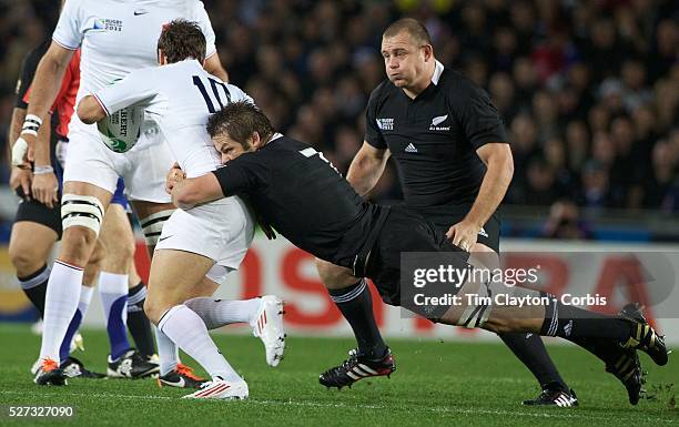 Richie McCaw, New Zealand, playing in his 100th test match, tackles Morgan Parra, France, during the New Zealand V France, Pool A match during the...