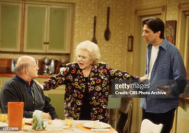 American actress Doris Roberts separates actors Peter Boyle and Ray Romano in a scene from an episode of 'Everybody Loves Raymond' entitiled 'The...