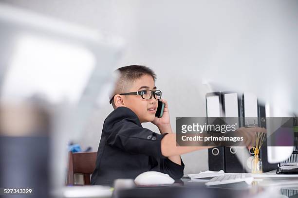 portrait of happy smile little business boy - children looking graph stock pictures, royalty-free photos & images