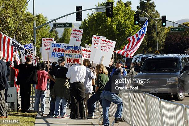 Iraq war protesters gather outside the Santa Barbara County courthouse as Michael Jackson's vehicles arrive for his child molestation trial April 29,...