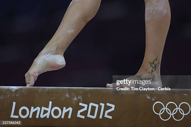 Study of gymnasts feet on the balance beam. One of the most challenging disciplines of the Olympic games sees young gymnasts performing amazing...