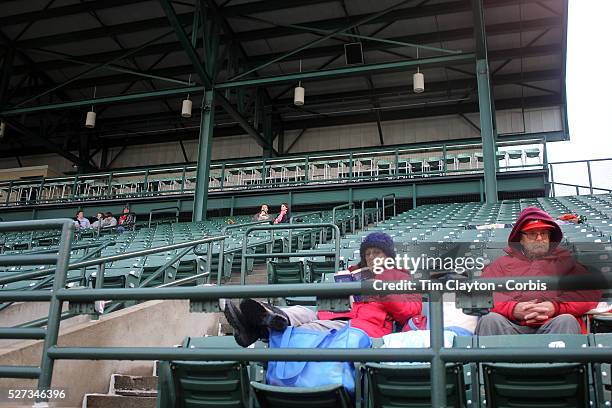 Fans in the stands on a cold and wet evening during the Rochester Red Wings V The Scranton/Wilkes-Barre RailRiders, Minor League ball game at...