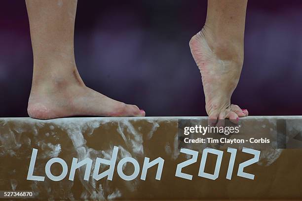 Study of gymnasts feet on the balance beam. One of the most challenging disciplines of the Olympic games sees young gymnasts performing amazing...