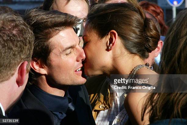Actor Tom Cruise kisses girlfriend Katie Holmes as they arrive at the David di Donatello Award ceremony to receive the Special David by Bulgari April...