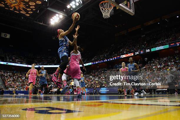 Monica Wright, , Minnesota Lynx, drives to the basket defended by Alex Bentley, Connecticut Sun, during the Connecticut Sun Vs Minnesota Lynx, WNBA...