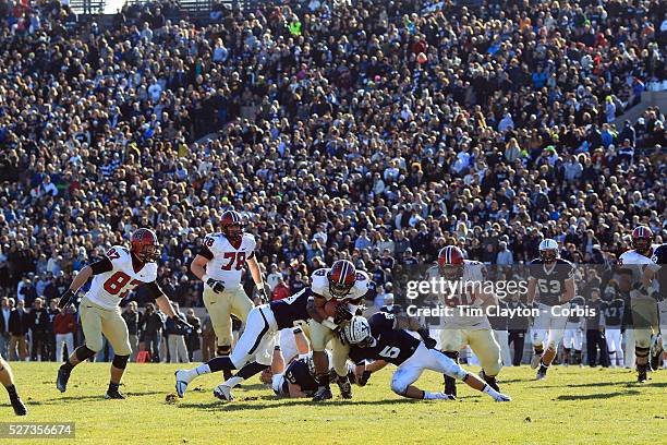 Seitu Smith II, , Harvard, running with a backdrop of the large crowd during the Yale V Harvard, Ivy League Football match at Yale Bowl. The game was...