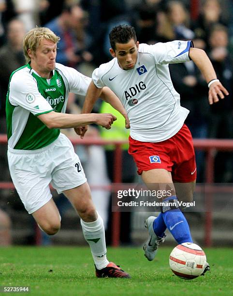 Tobias Schaeper of Muenster challenges for the ball with Mustafa Asma of Hamburg during the match of the Third League between Hamburger SV Amateurs...