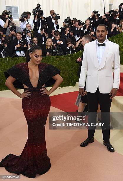 Camello And La La Anthony arrive for the Costume Institute Benefit at the Metropolitan Museum of Art on May 2, 2016 in New York. / AFP / TIMOTHY A....