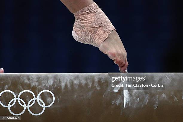 Study of gymnasts feet on the balance beam. One of the most challenging disciplines of the Olympic games sees young gymnasts performing amazing...