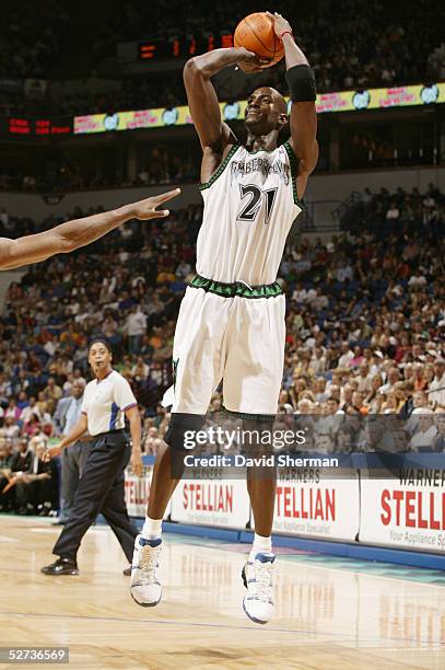 Kevin Garnett of the Minnesota Timberwolves shoots against the Seattle Sonics during the game at Target Center on April 17, 2005 in Minneapolis,...