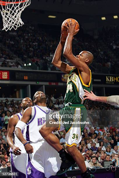 Ray Allen of the Seattle SuperSonics shoots over Cuttino Mobley of the Sacramento Kings in Game three of the Western Conference First Round during...