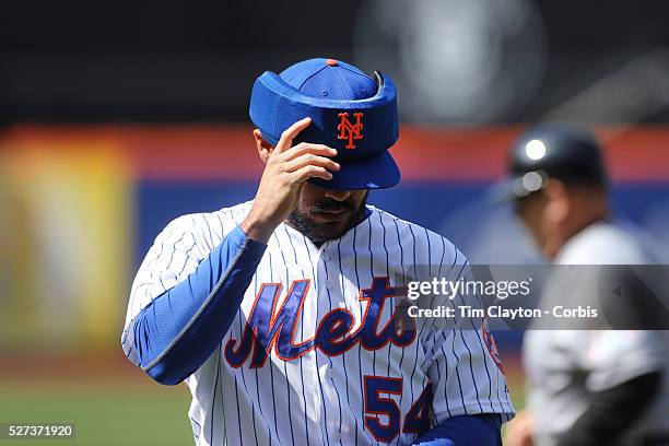 Pitcher Alex Torres, New York Mets, wearing protective head gear while pitching during the New York Mets Vs Miami Marlins MLB regular season baseball...