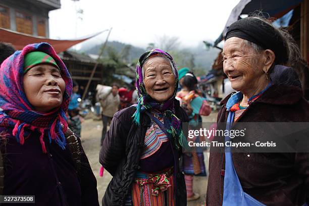 Elderly visitors to the Lung Khau Nhin Market. Vietnam. Lung Khau Nhin Market is rural tribal market hiding itself amongst the mountains and forests...