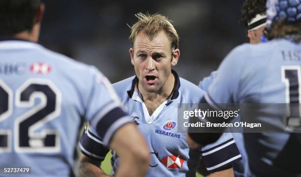 Chris Whitaker of the Waratahs talks to his team during the Super 12 match between the Highlanders and the NSW Waratahs at Carisbrook Stadium on...