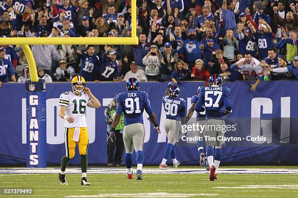 Jason Pierre-Paul, New York Giants, heads for the end zone after picking off Packers Quarterback Scott Tolzien, , during the New York Giants Vs Green...