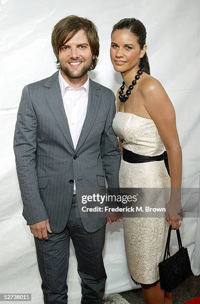 Actor Adam Scott and Naomi Sablan arrive at New Line Cinema's Premiere of "Monster In Law" at the Mann National Theatre on April 29, 2005 in...