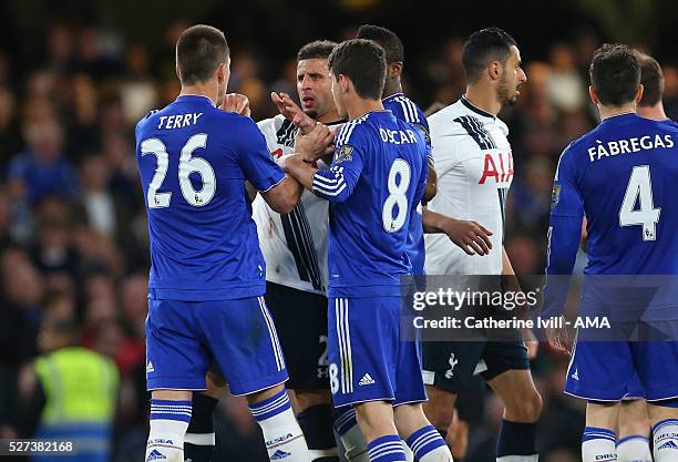 John Terry of Chelsea holds back Kyle Walker of Tottenham Hotspur during the Barclays Premier League match between Chelsea and Tottenham Hotspur at...