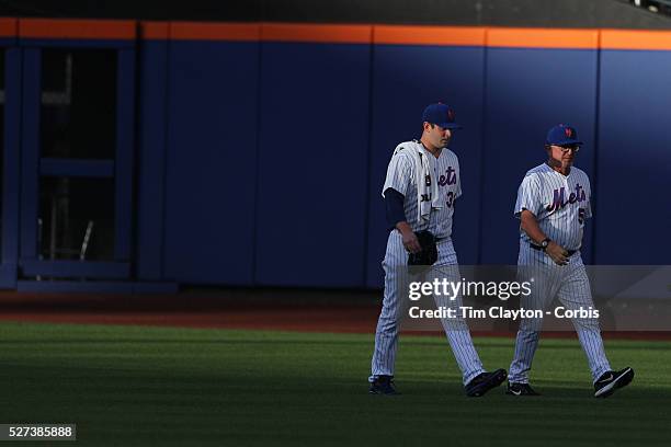 Pitcher Matt Harvey, New York Mets, heads to the dugout with pitching coach Dan Wharten after warm up before the New York Mets Vs Toronto Blue Jays...