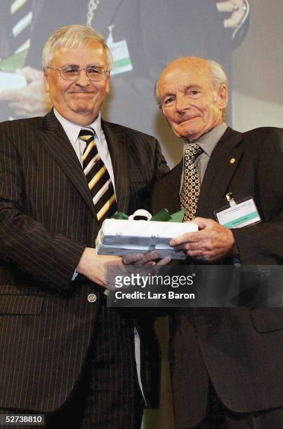 President Dr. Theo Zwanziger gives a birthdaypresent to Dettmar Cramer during the 50th annual football teacher seminar at the german academy of sport...