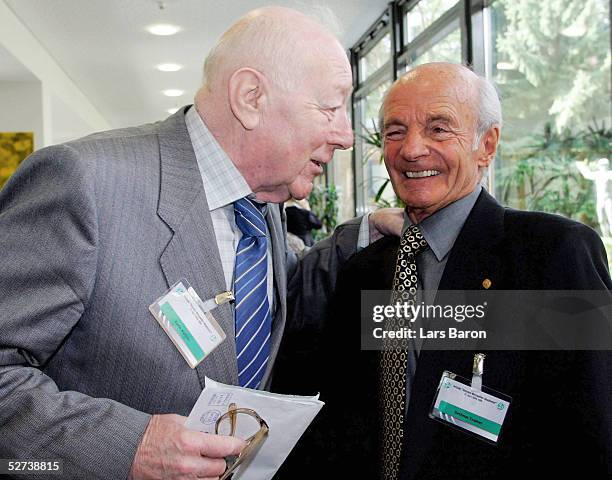 Kuno Kloetzer talks to Dettmar Cramer during the 50th annual Football Teacher Seminar at the German Academy of Sport on April 27, 2005 in Cologne,...