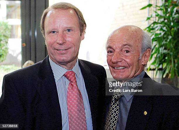 Berti Vogts and Dettmar Cramer pose during the 50th annual Football Teacher Seminar at the German Academy of Sport on April 27, 2005 in Cologne,...