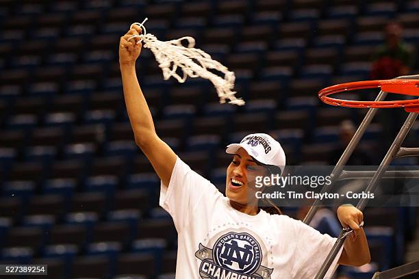 Skylar Diggins, Notre Dame, cuts the basketball net after the Connecticut V Notre Dame Final match won by Notre Dame 61-59 during the Big East...