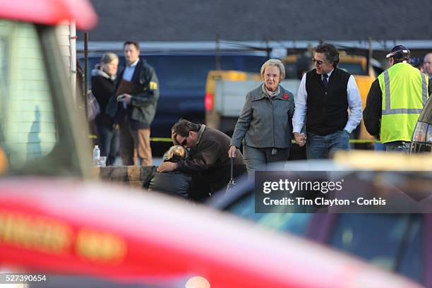 Unidentified people, believed to be parents and relatives, leaving the fire station in Sandy Hook after today's shootings at Sandy Hook Elementary...