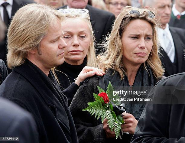 Maria Schell's son Oliver Schell, left, her daughter Marie Theres Kroetz-Relin, right, and her sister in law Natascha Schell, center, attend the...