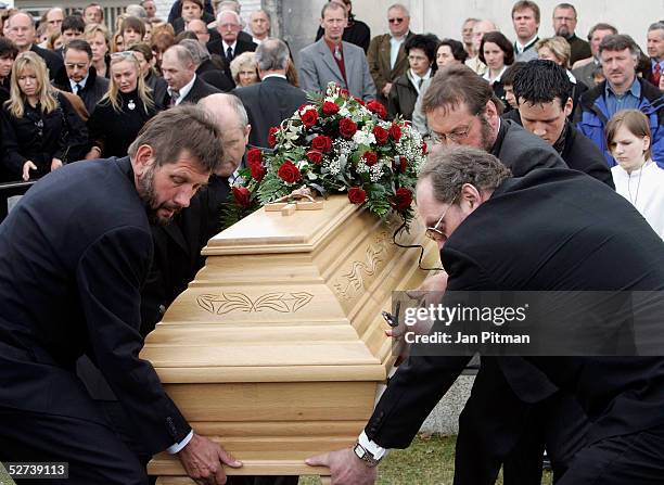 The coffin is lowered in the grave during the funeral of actress Maria Schell at the Nikolaus church on April 30, 2005 in Preitenegg, Austria. The...