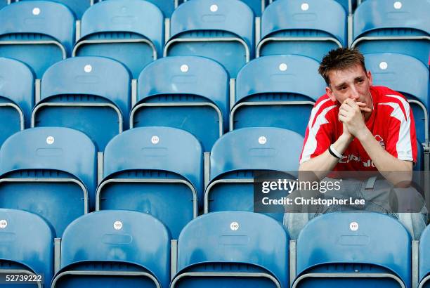 Nottingham Forest fan looks dejected after his side lose during the Coca-Cola Championship match between Queens Park Rangers and Nottingham Forest at...