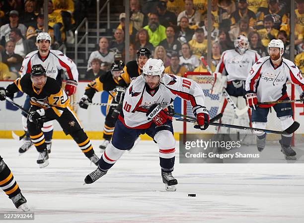 Mike Richards of the Washington Capitals moves the puck up ice during the first period against the Pittsburgh Penguins in Game Three of the Eastern...