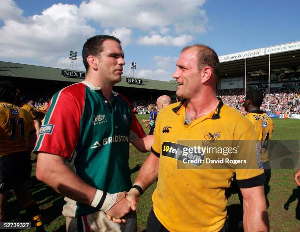 An emotional Leicester captain Martin Johnson shakes hands with Wasps captain Lawrence Dallaglio after being involved in his last game at Welford...